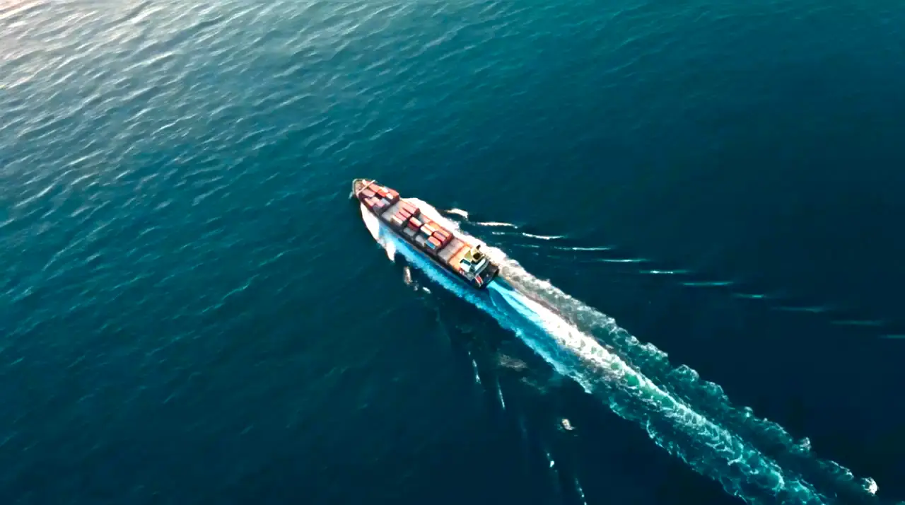 Container ship seen from directly above, under way on open ocean